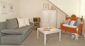 Wohnzimmer mit Schlafsofa 